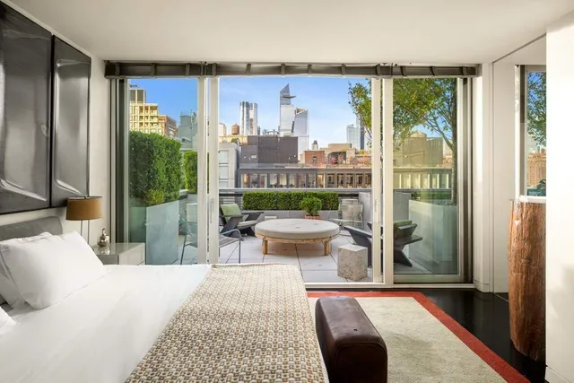 a view of a patio with couches table and chairs and potted plants