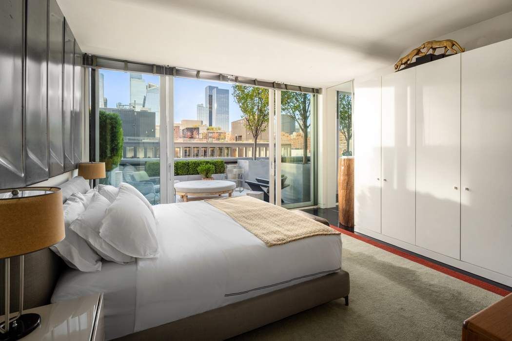 524 West 19th Street, Unit PH Manhattan, NY 10011 - Photo 16 of 27 a bedroom with a bed and large window