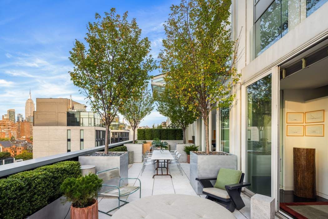 524 West 19th Street, Unit PH Manhattan, NY 10011 - Photo 17 of 27 a view of a patio with couches table and chairs and potted plants