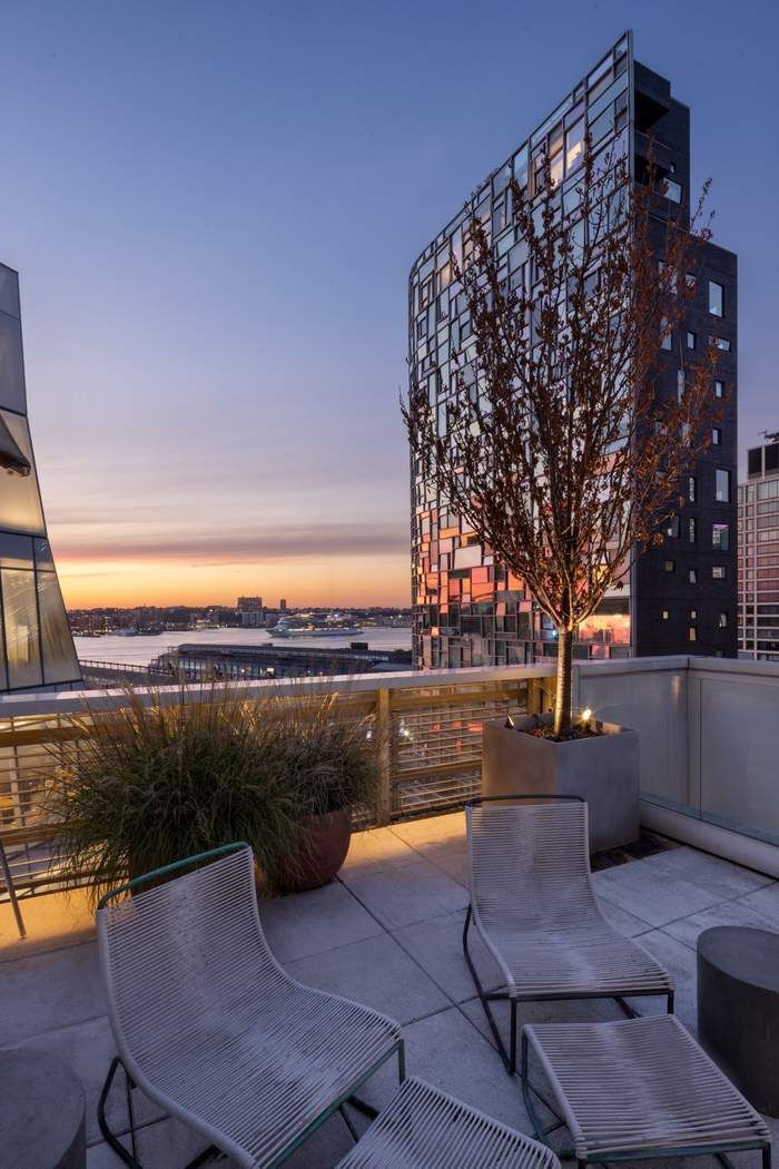 524 West 19th Street, Unit PH Manhattan, NY 10011 - Photo 24 of 27 a terrace with outdoor seating and city view