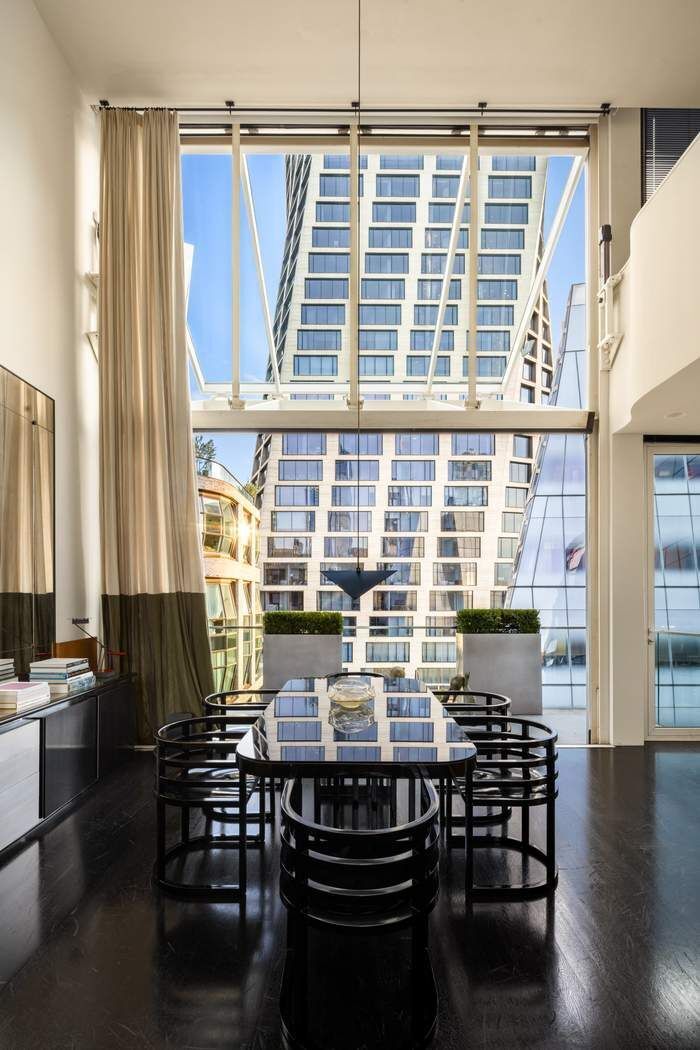 524 West 19th Street, Unit PH Manhattan, NY 10011 - Photo 7 of 27 a view of a dining room with furniture and wooden floor