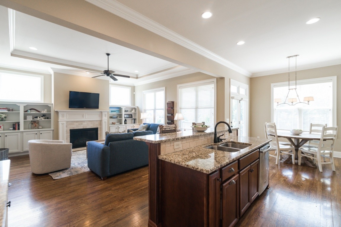 192 Barlow Drive Franklin, TN 37064 - Photo 11 of 36 a kitchen with a stove kitchen island furniture and a fireplace
