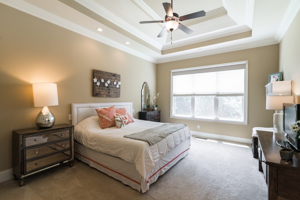 192 Barlow Drive Franklin, TN 37064 - Photo 14 of 36 a bedroom with a bed a dresser and a window