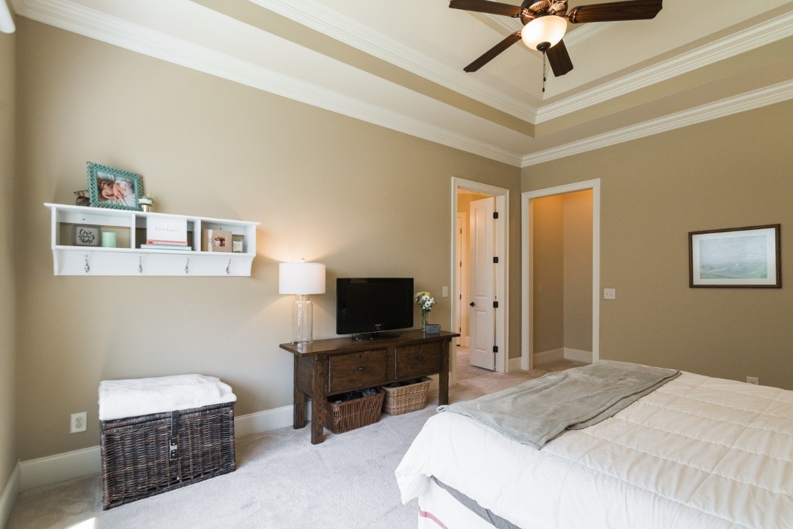 192 Barlow Drive Franklin, TN 37064 - Photo 15 of 36 a bedroom with a bed and a flat screen tv