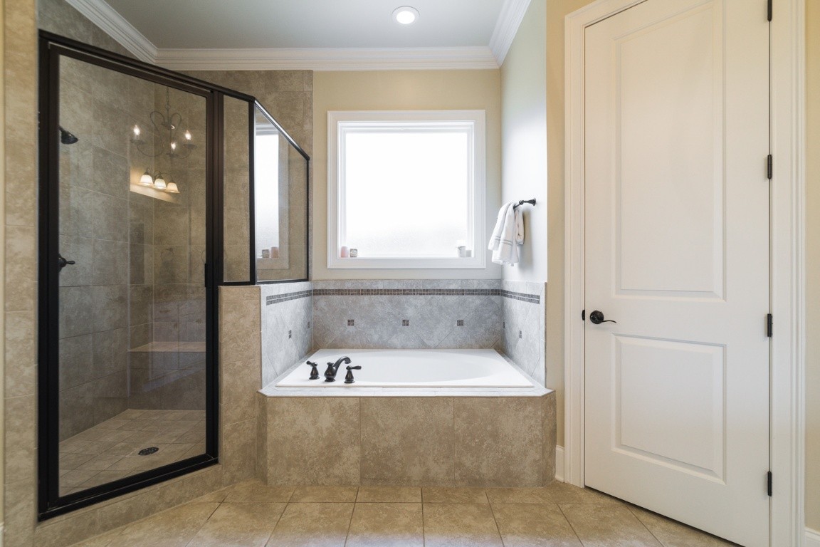 192 Barlow Drive Franklin, TN 37064 - Photo 16 of 36 a bath tub sitting next to a bathroom sink