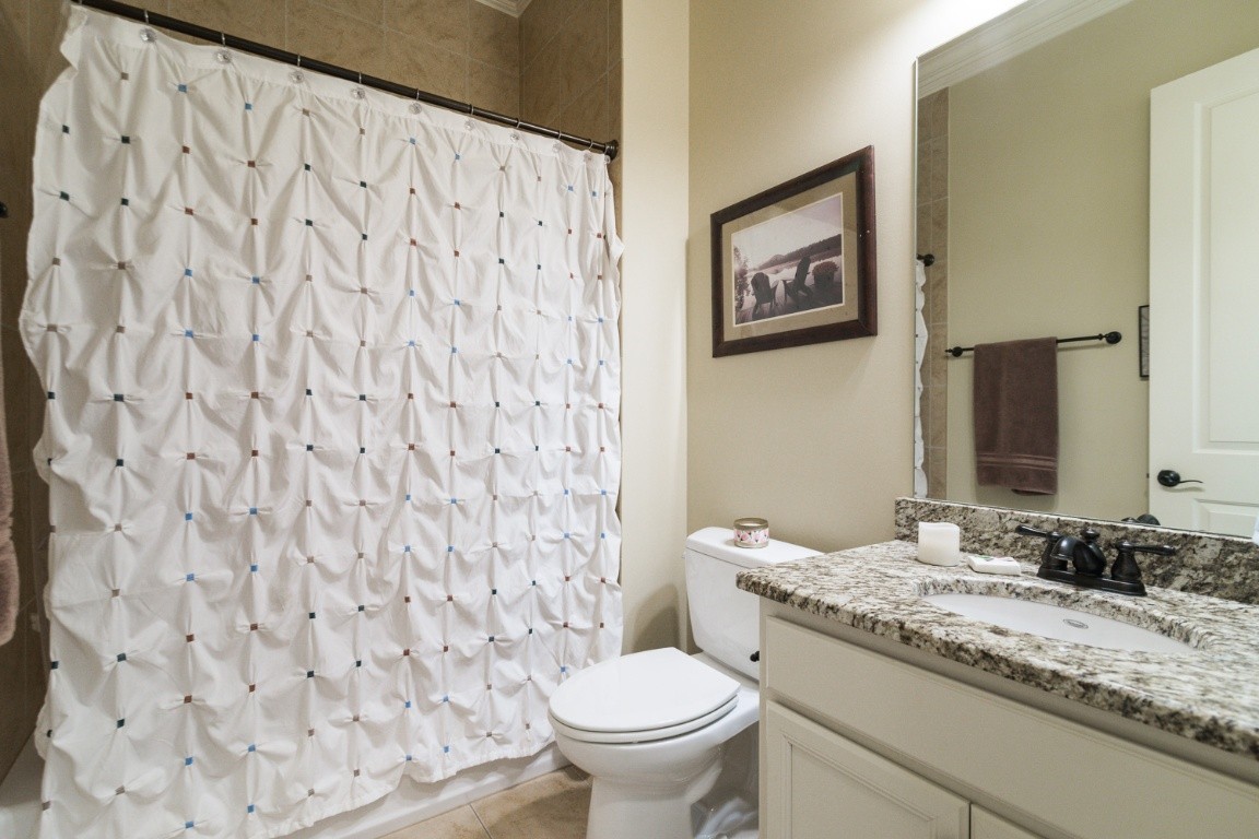 192 Barlow Drive Franklin, TN 37064 - Photo 21 of 36 a bathroom with a granite countertop toilet and a sink