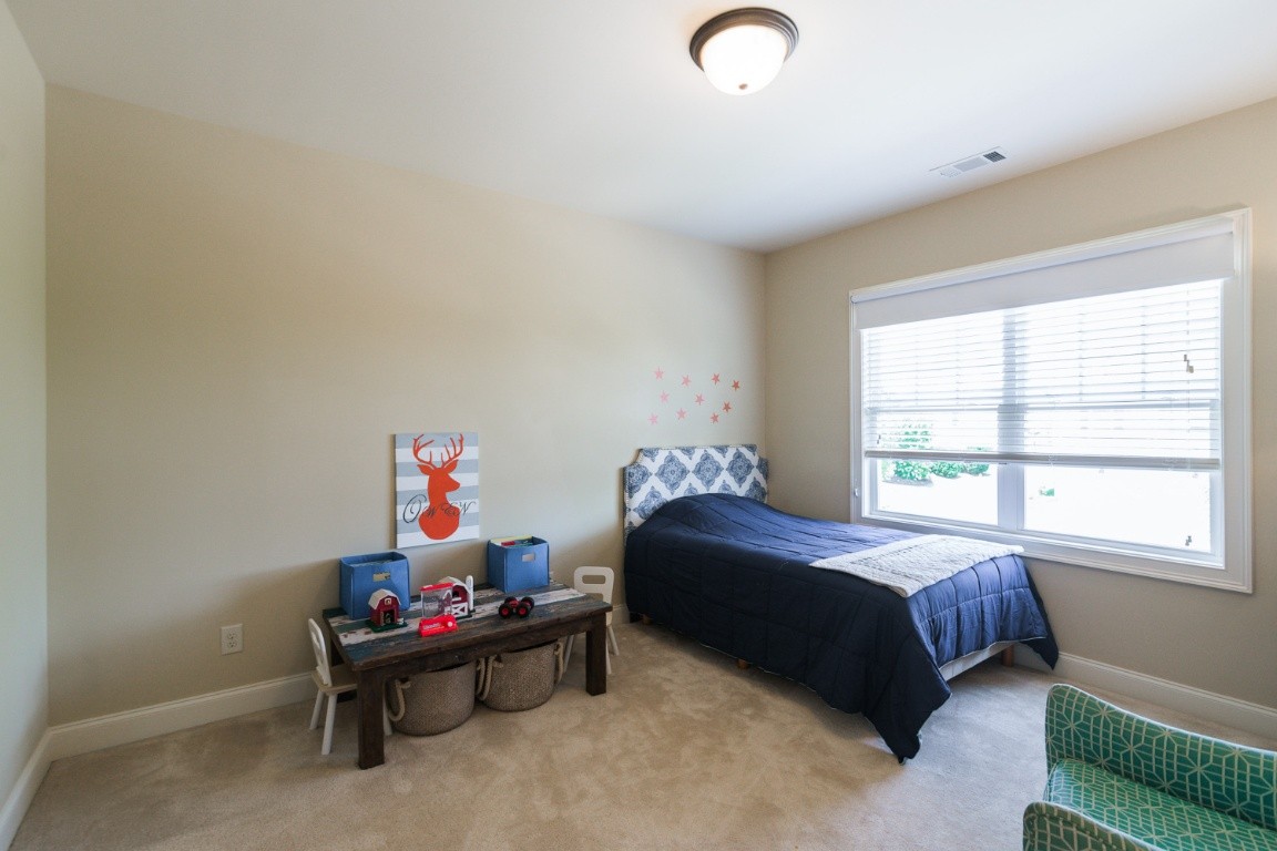 192 Barlow Drive Franklin, TN 37064 - Photo 24 of 36 a bedroom with a bed and a window
