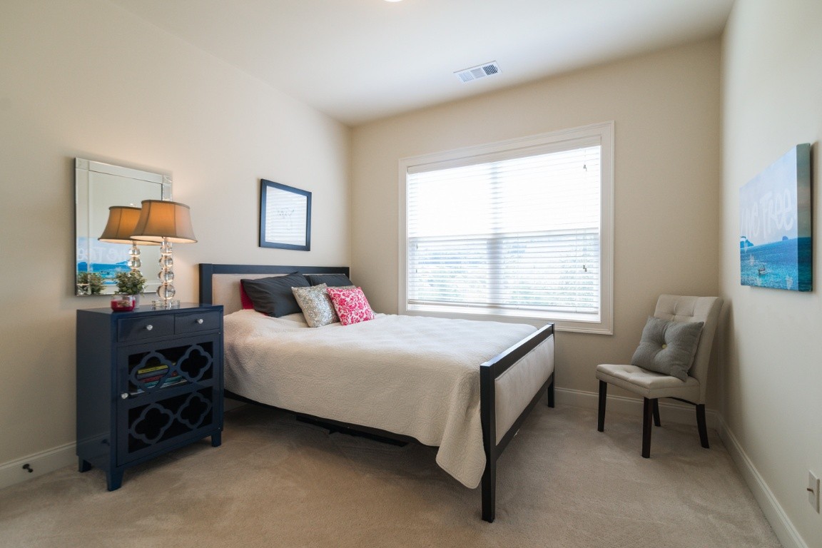 192 Barlow Drive Franklin, TN 37064 - Photo 26 of 36 a bedroom with a bed and a couch