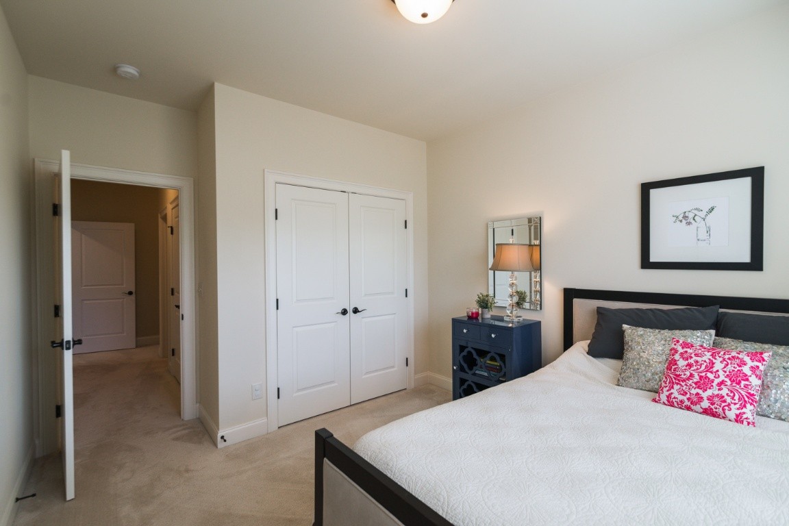 192 Barlow Drive Franklin, TN 37064 - Photo 27 of 36 a bedroom with a bed and painting on the wall