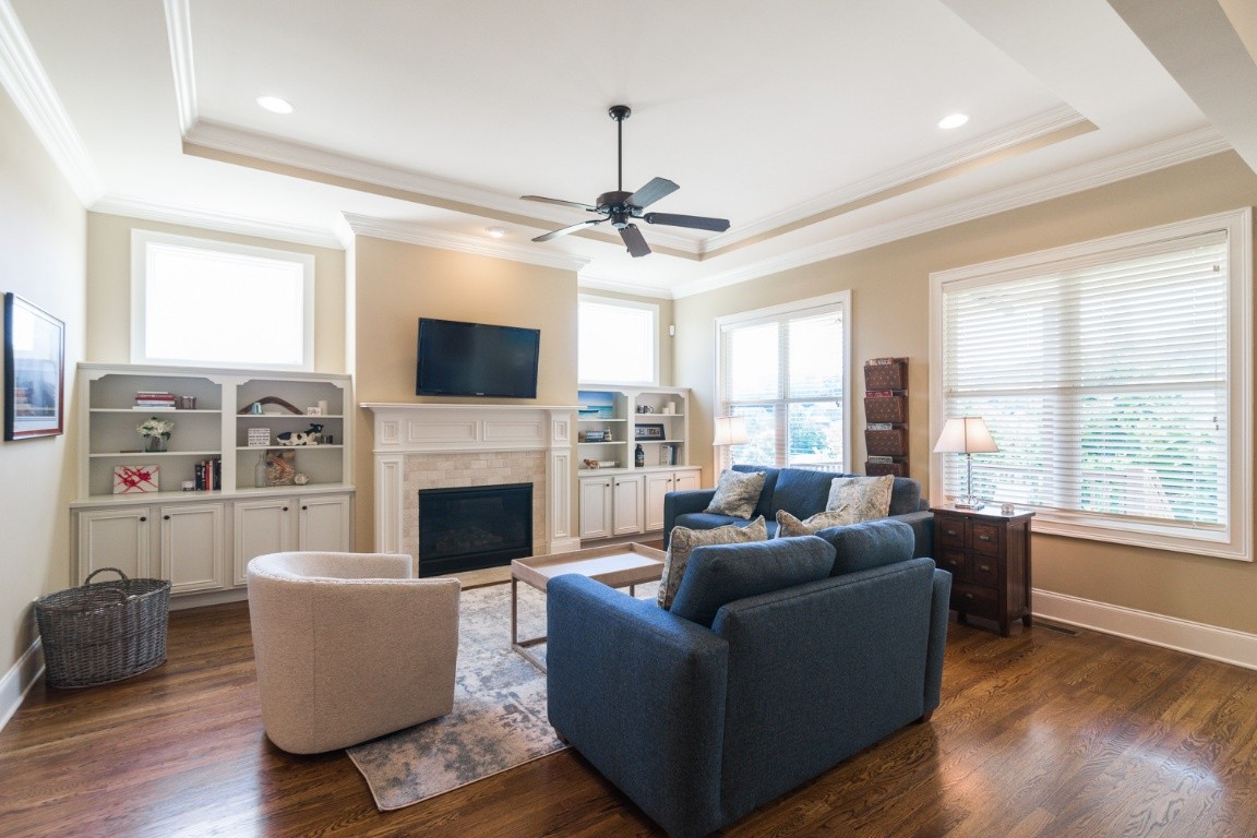 192 Barlow Drive Franklin, TN 37064 - Photo 6 of 36 a living room with furniture a fireplace and a flat screen tv