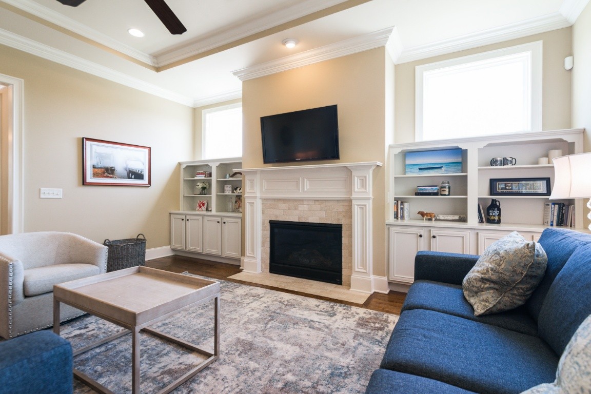 192 Barlow Drive Franklin, TN 37064 - Photo 7 of 36 a living room with furniture a flat screen tv and a fireplace