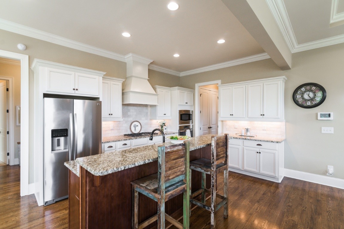 192 Barlow Drive Franklin, TN 37064 - Photo 9 of 36 a kitchen with granite countertop cabinets and stainless steel appliances
