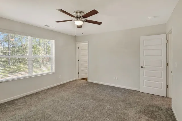 a view of an empty room with a window