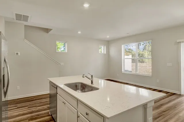 a kitchen with a sink and a window