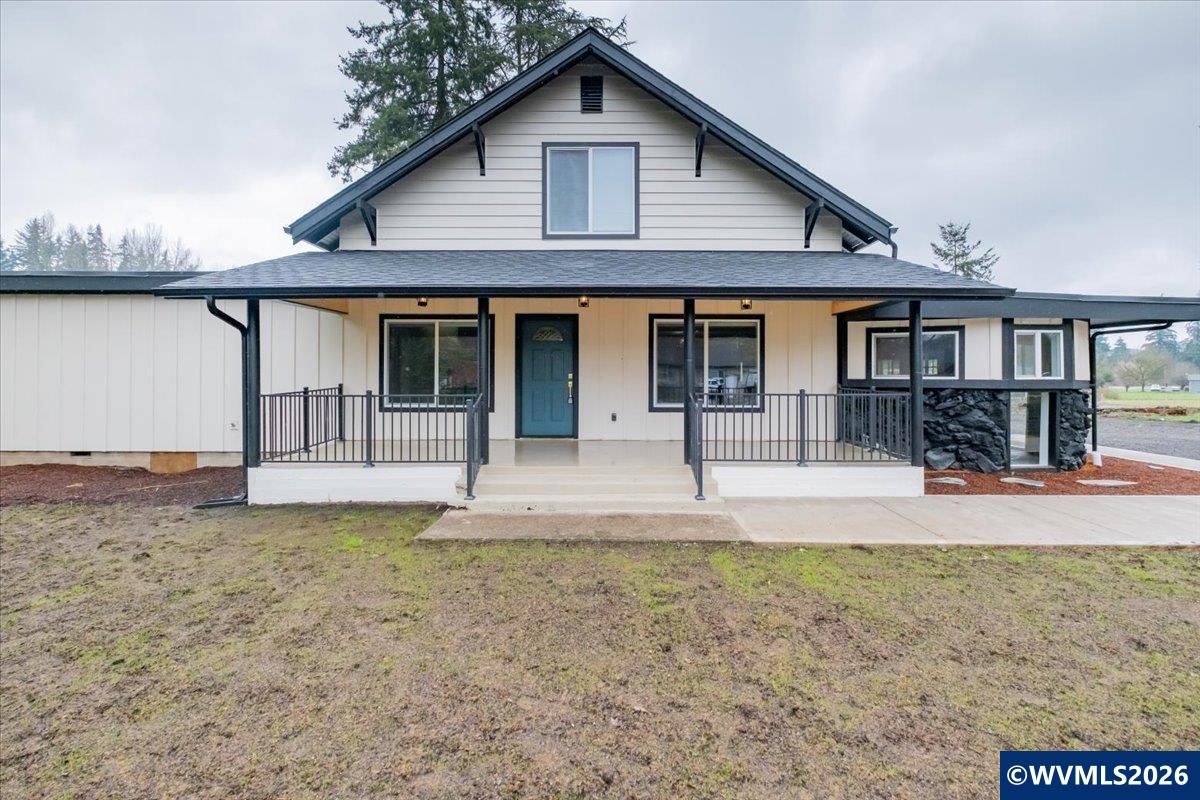 28411 Liberty Road Sweet Home, OR 97386 - Photo 3 of 50 a front view of a house with garden