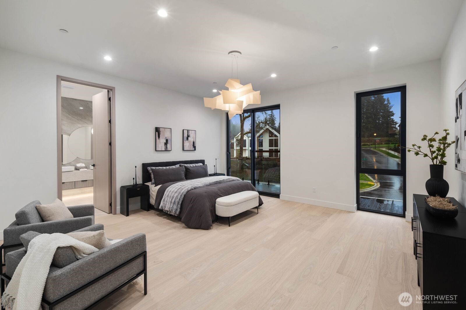 4599 Northwest 71st Avenue Camas, WA 98607 - Photo 35 of 40 a bedroom with a bed and chandelier