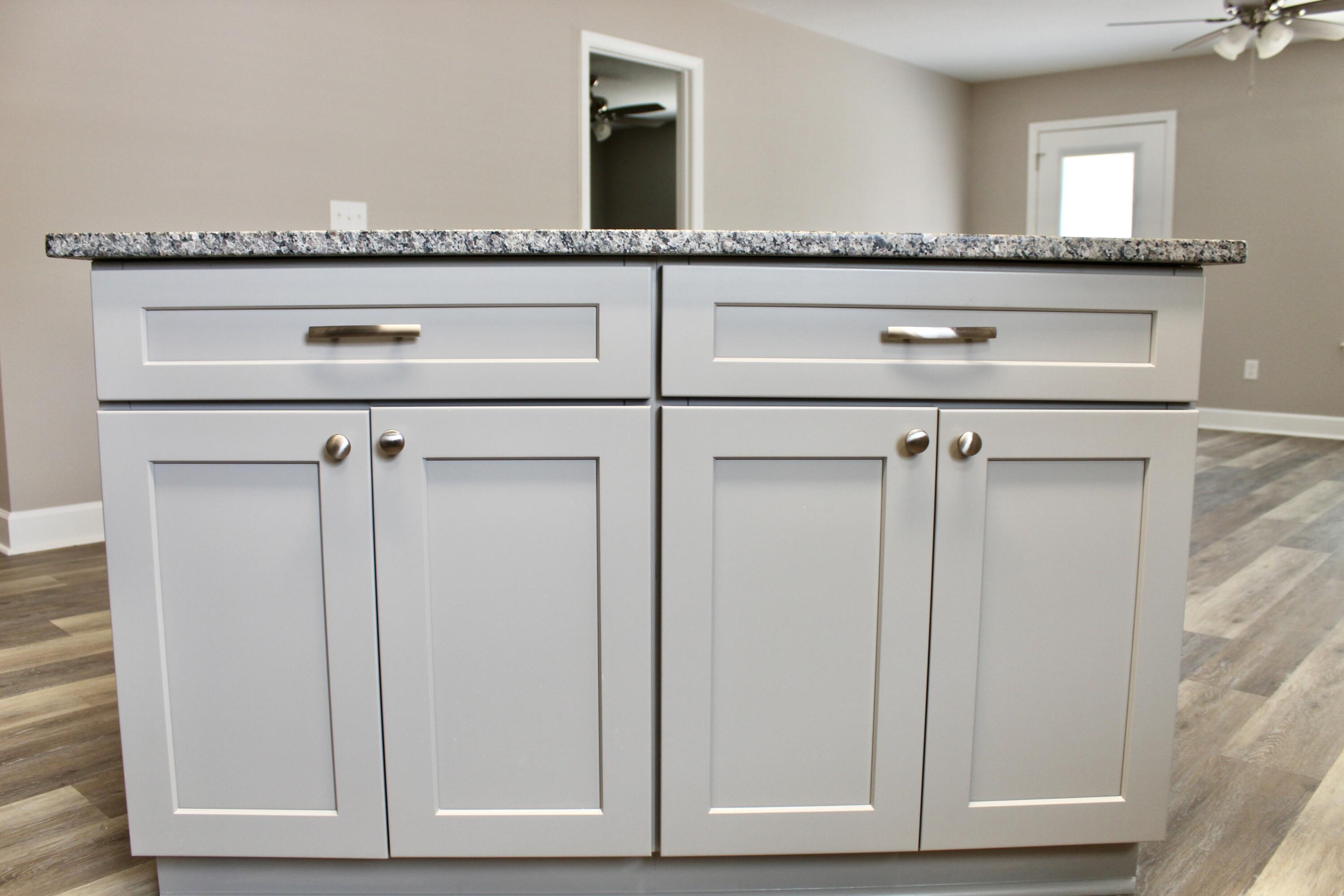 4639 Falcon Way Crestview, FL 32539 - Photo 15 of 40 a close view of a utility room with granite countertop cabinets