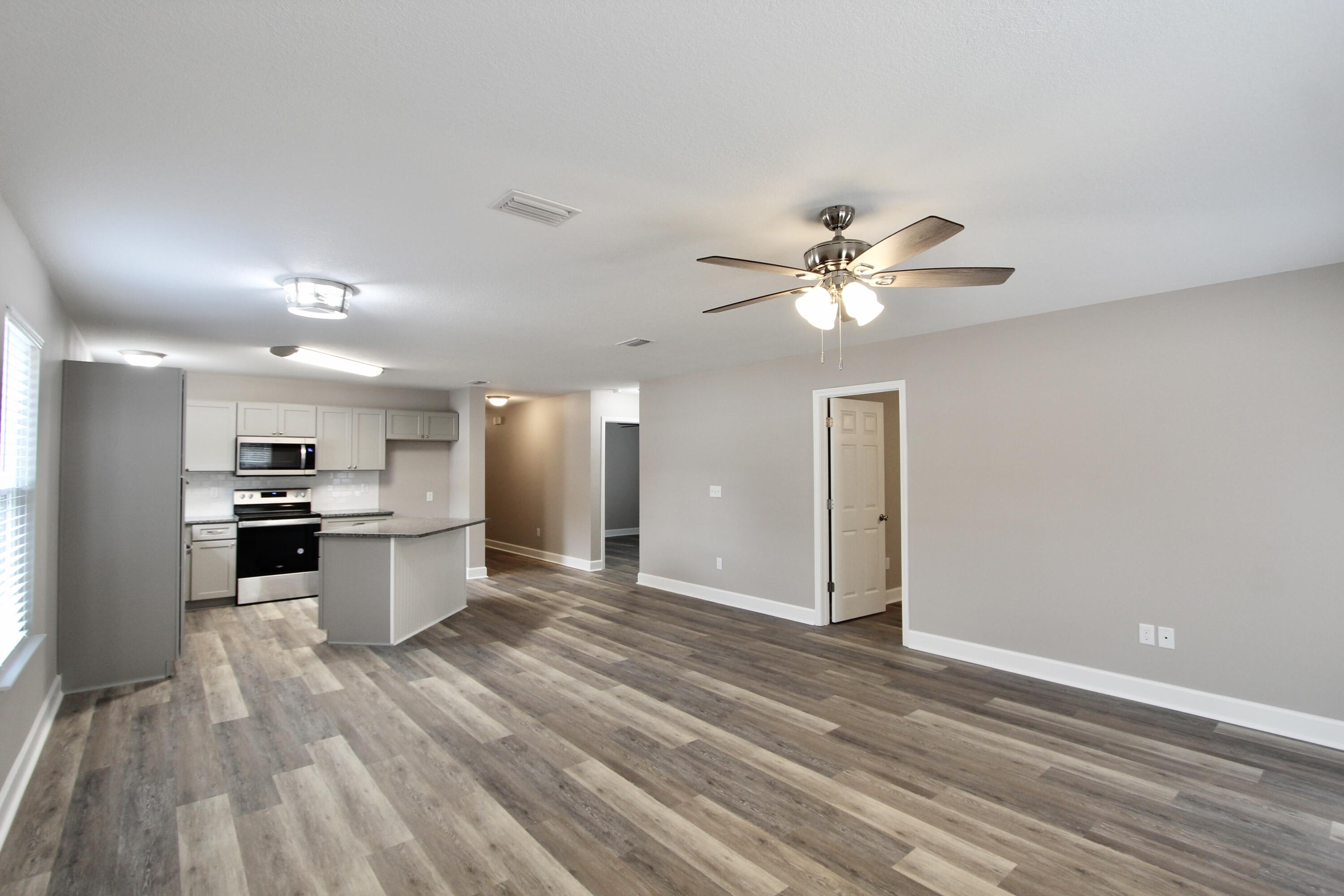 4639 Falcon Way Crestview, FL 32539 - Photo 22 of 40 a view of kitchen with sink microwave and stove