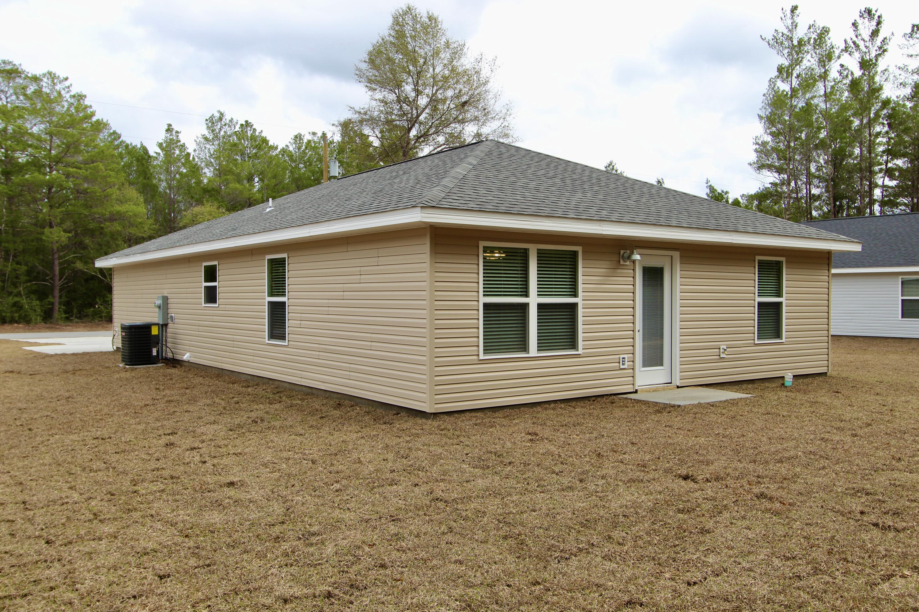 4639 Falcon Way Crestview, FL 32539 - Photo 37 of 40 a view of a house with a yard