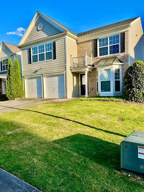 9020 Friarbridge Drive Suwanee, GA 30024 - Photo 1 of 48 a front view of a house with a yard