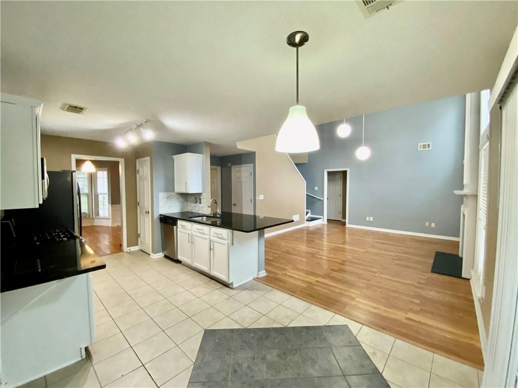 9020 Friarbridge Drive Suwanee, GA 30024 - Photo 18 of 48 a large white kitchen with a large window
