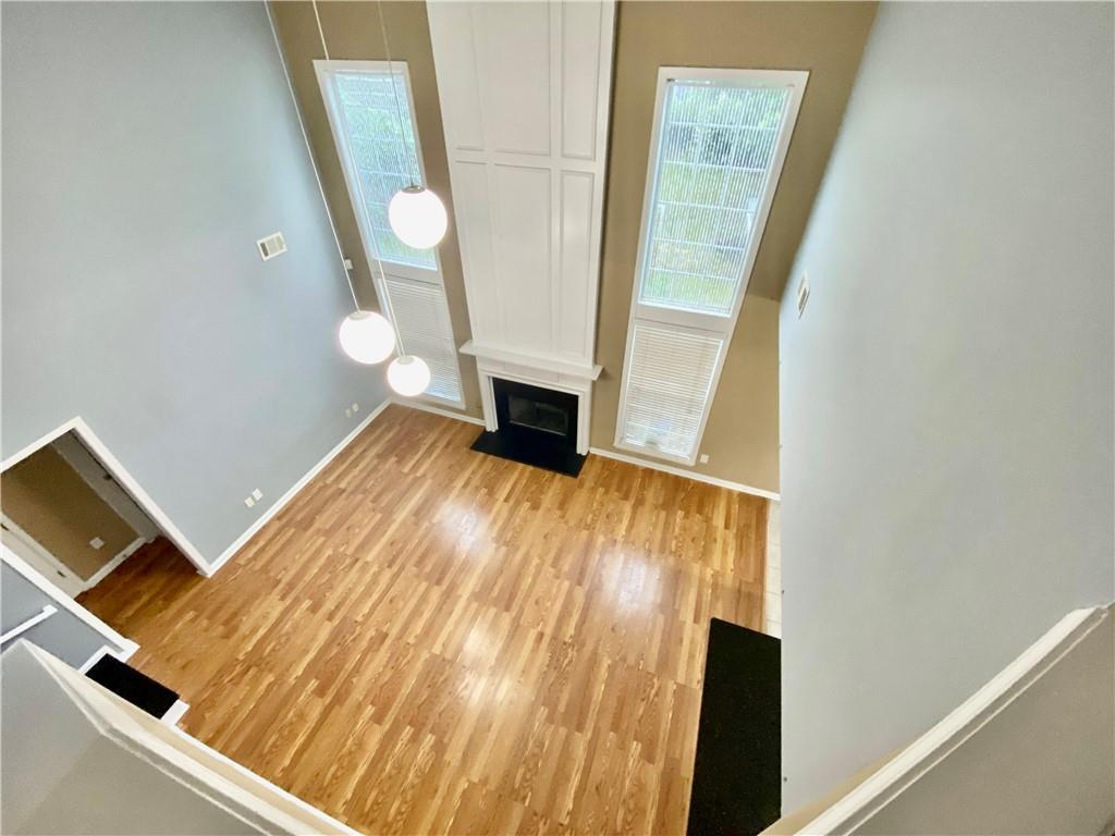 9020 Friarbridge Drive Suwanee, GA 30024 - Photo 25 of 48 a view of an empty room and wooden floor
