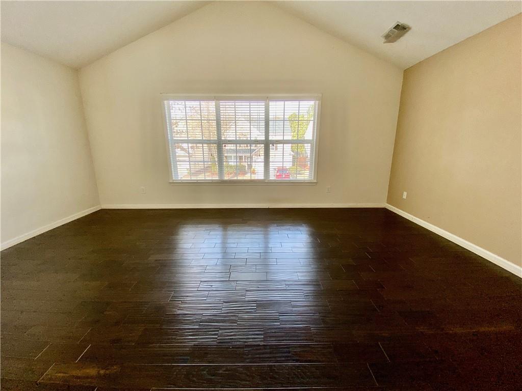 9020 Friarbridge Drive Suwanee, GA 30024 - Photo 26 of 48 wooden floor in an empty room with a window