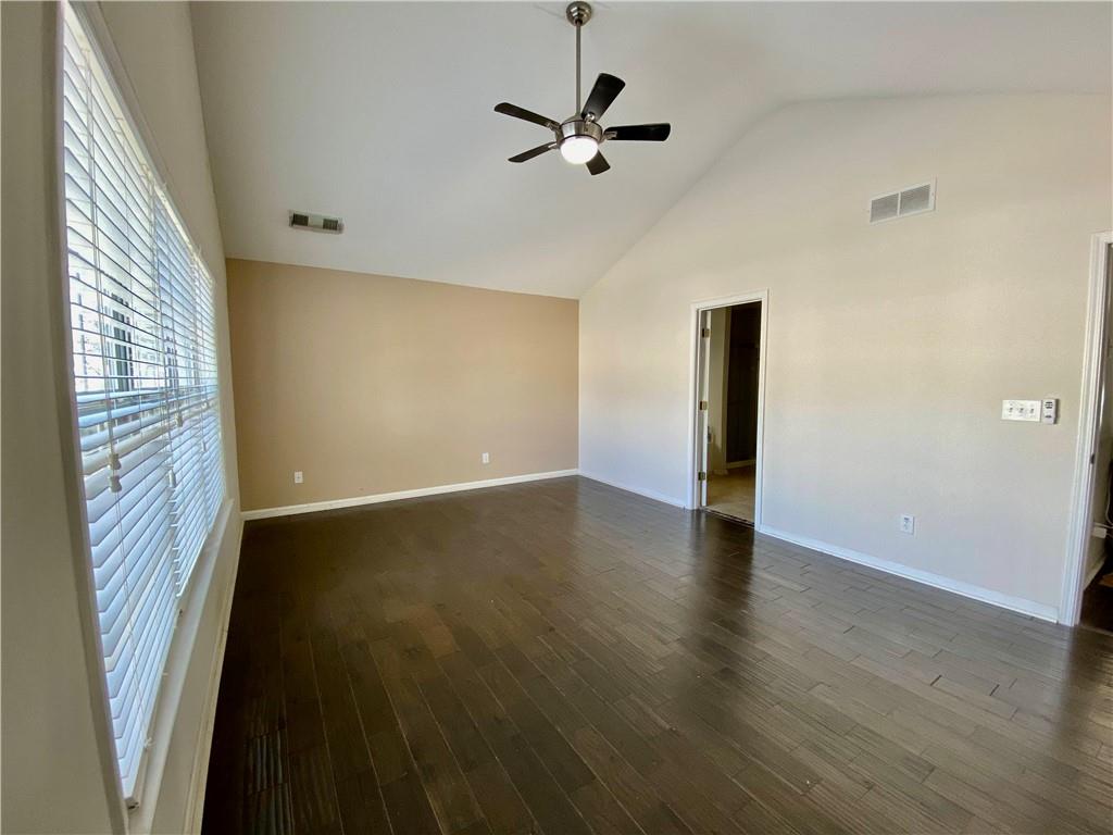 9020 Friarbridge Drive Suwanee, GA 30024 - Photo 28 of 48 a view of an empty room with wooden floor and a window