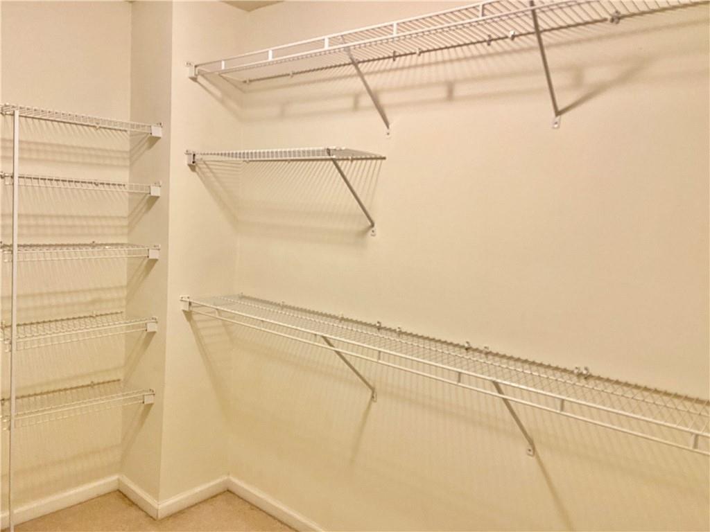 9020 Friarbridge Drive Suwanee, GA 30024 - Photo 30 of 48 a bathroom with a shower