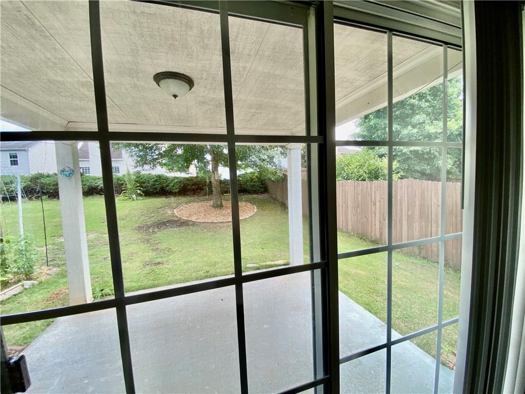 9020 Friarbridge Drive Suwanee, GA 30024 - Photo 43 of 48 a view of a glass door with a floor to ceiling window