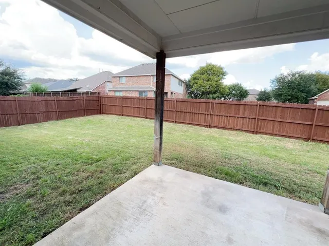 a view of a backyard with a garden