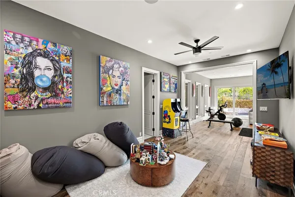 a front view of a house with swimming pool having outdoor seating