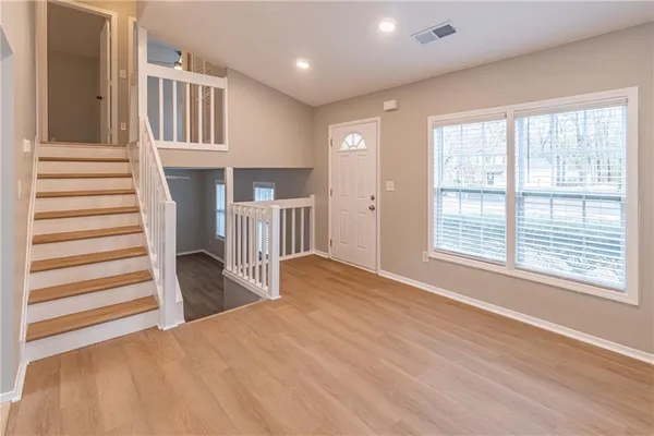 a view of livingroom with furniture and staircase