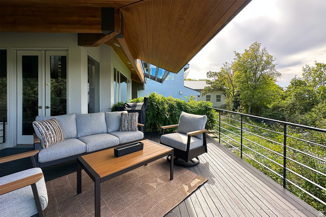 11454 South Oberland Road Sandy, UT 84092 - Photo 78 of 103 Expansive outdoor deck with wood-finish ceiling, double glass-paneled doors, and contemporary metal railing