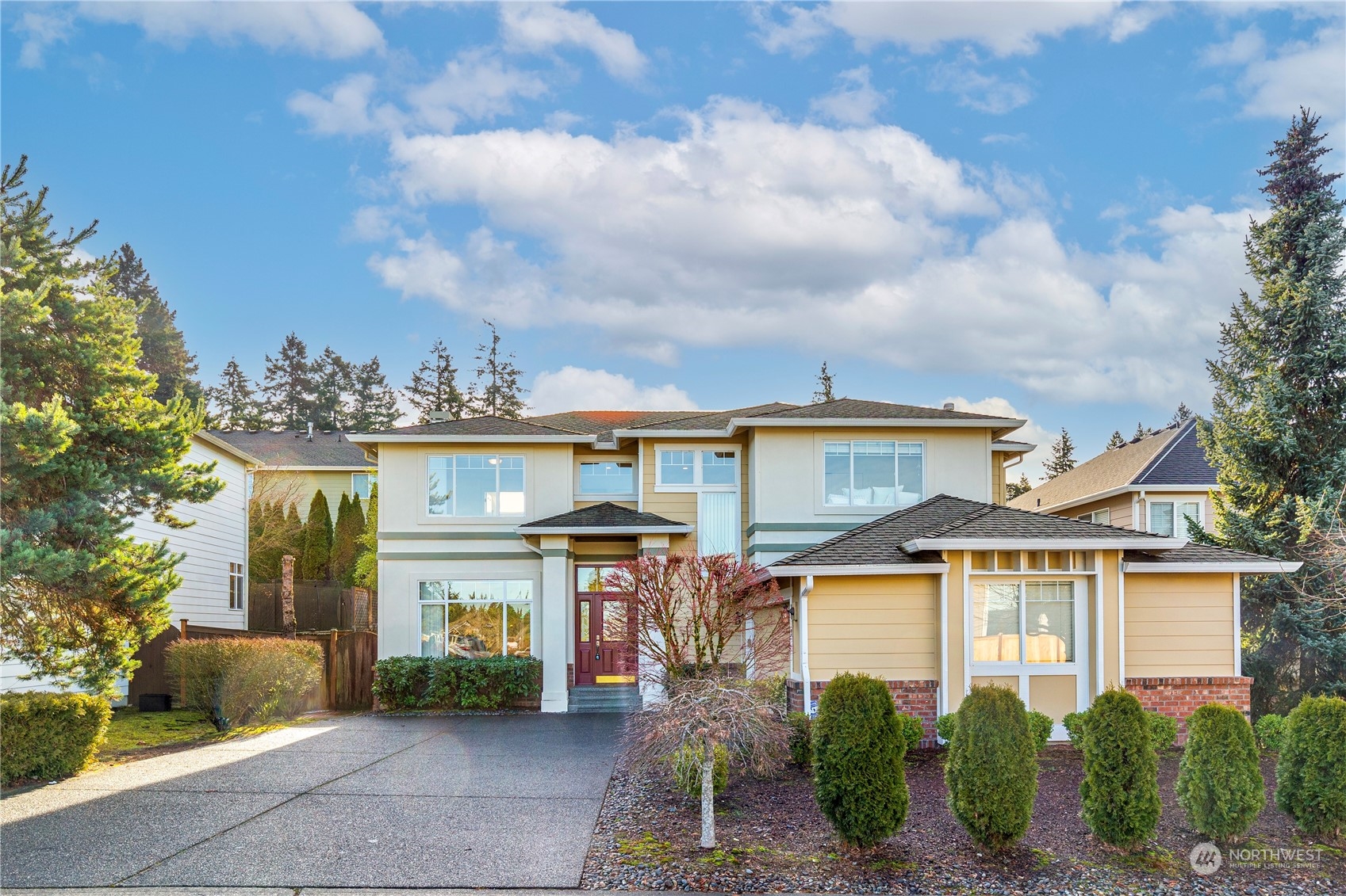 2019 Northeast 33rd Place Renton, WA 98056 - Photo 1 of 28 a front view of a house with garden