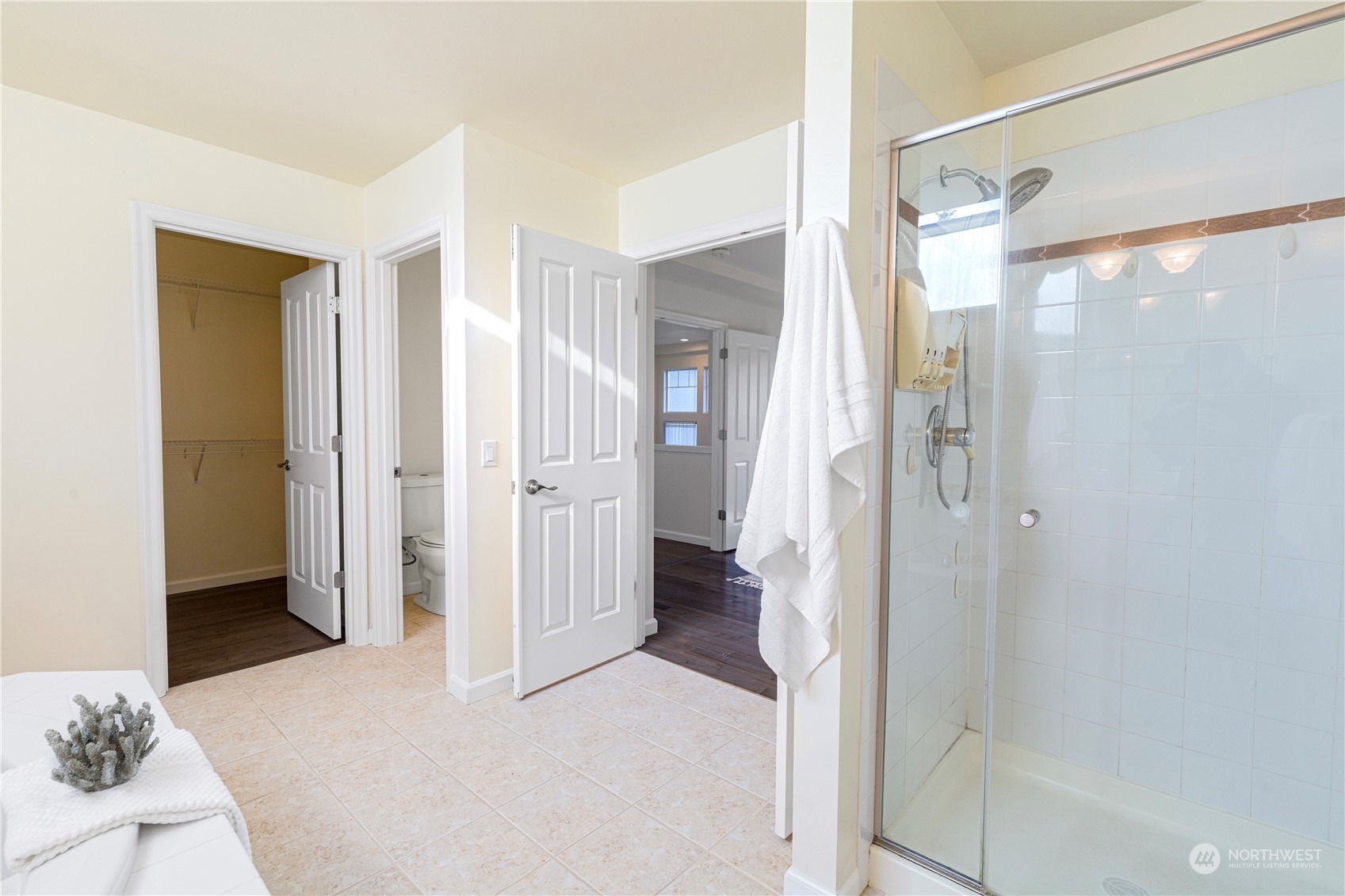 2019 Northeast 33rd Place Renton, WA 98056 - Photo 21 of 28 a view of a bathroom with a glass door shower