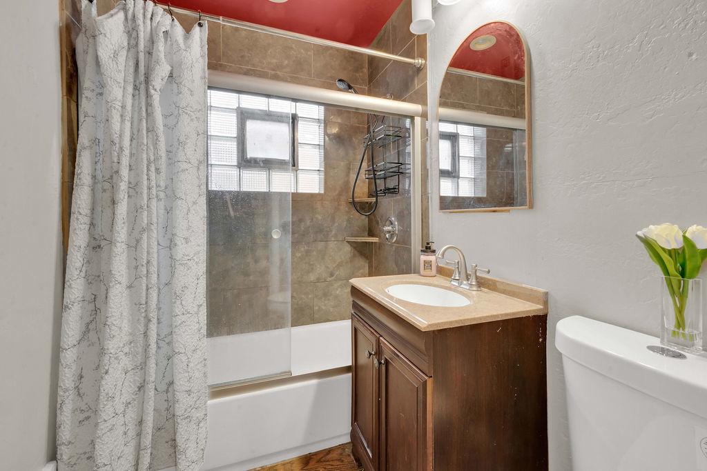 7234 South Ridgeway Avenue Chicago, IL 60629 - Photo 7 of 27 a bathroom with a sink a toilet and shower