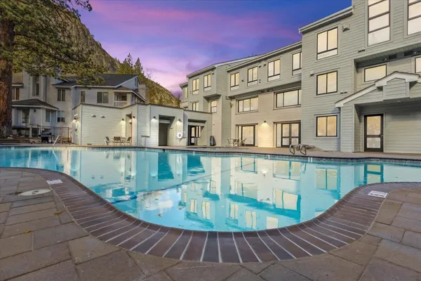 a view of a balcony with swimming pool