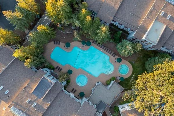 an aerial view of a house with a swimming pool