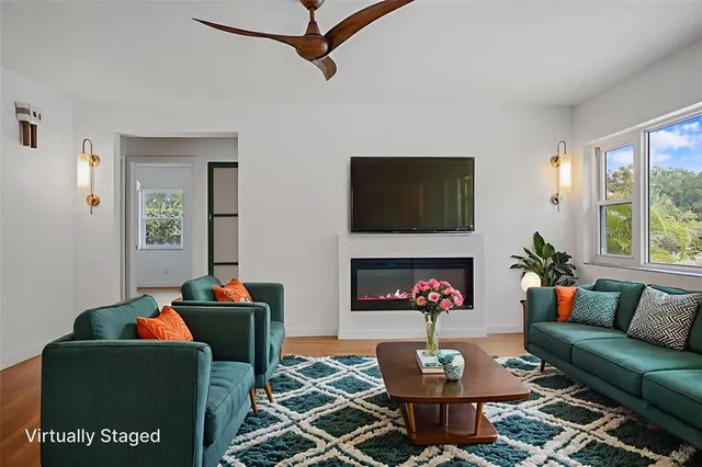 a view of swimming pool with red chairs