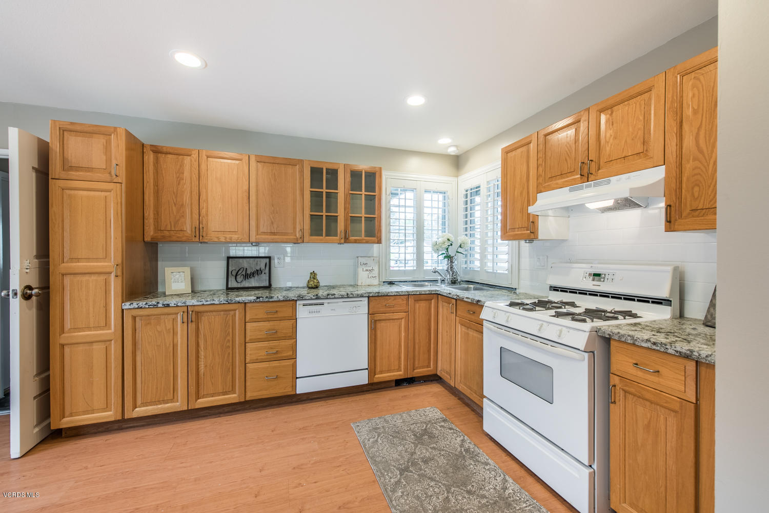 798 Appleton Road Simi Valley, CA 93065 - Photo 27 of 31 a kitchen with stainless steel appliances granite countertop a stove a sink dishwasher a refrigerator and cabinets with wooden floor
