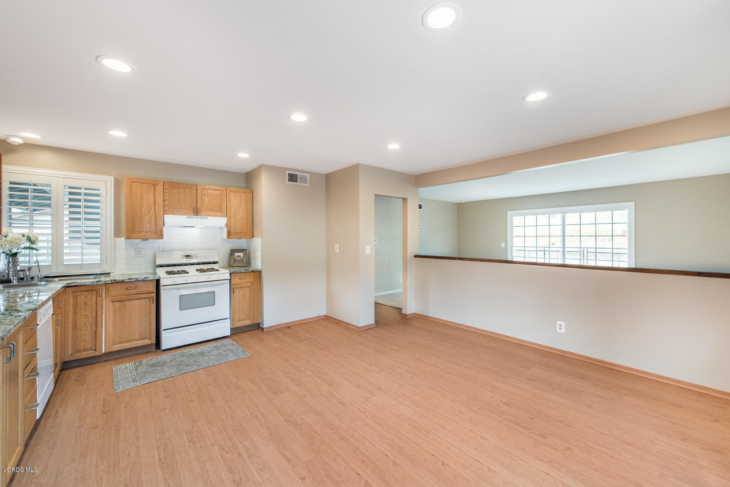 798 Appleton Road Simi Valley, CA 93065 - Photo 6 of 31 a large kitchen with stainless steel appliances granite countertop a stove and a refrigerator