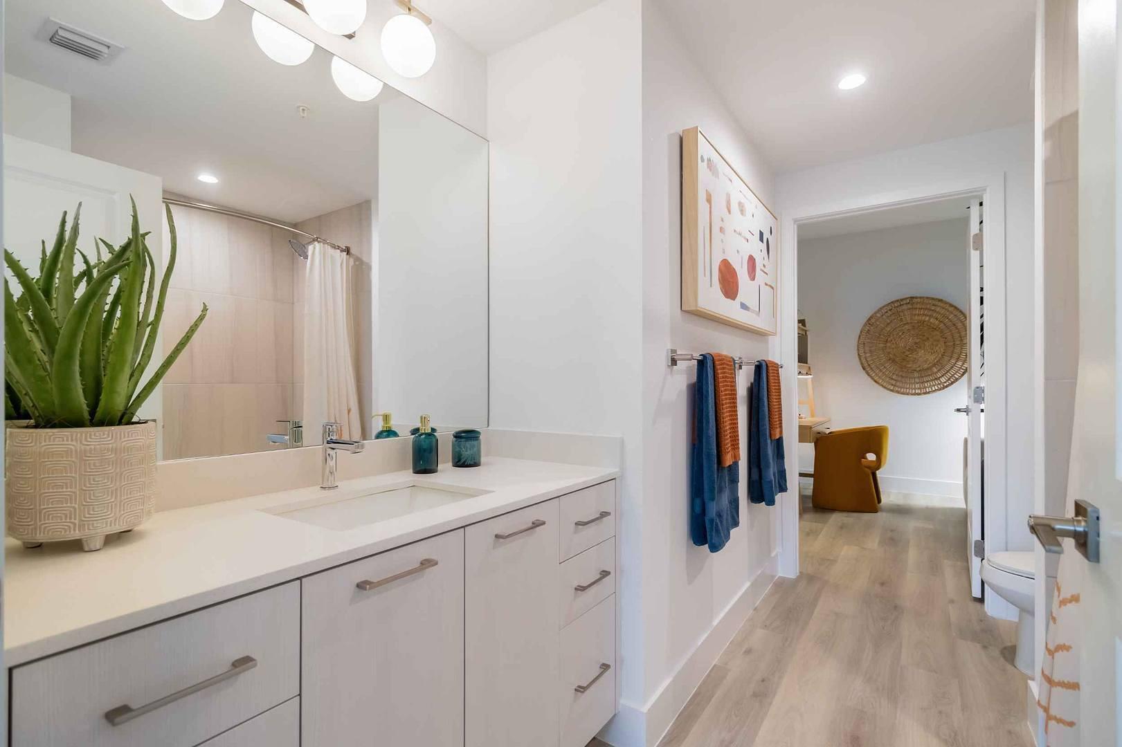 2985 Southwest 122nd Avenue, Unit 101 Miramar, FL 33025 - Photo 7 of 16 a spacious bathroom with a sink a mirror and a shower