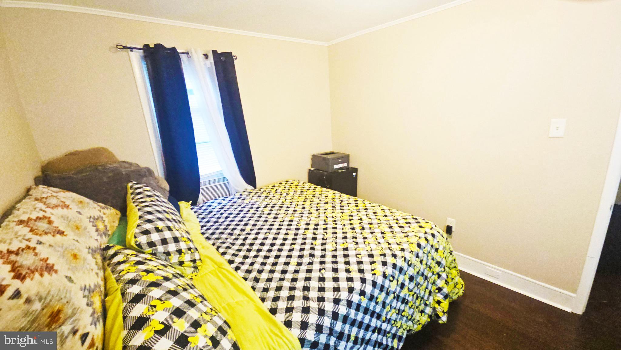 567 South Fairview Street Riverside, NJ 08075 - Photo 12 of 29 a bedroom with a bed and wooden floor