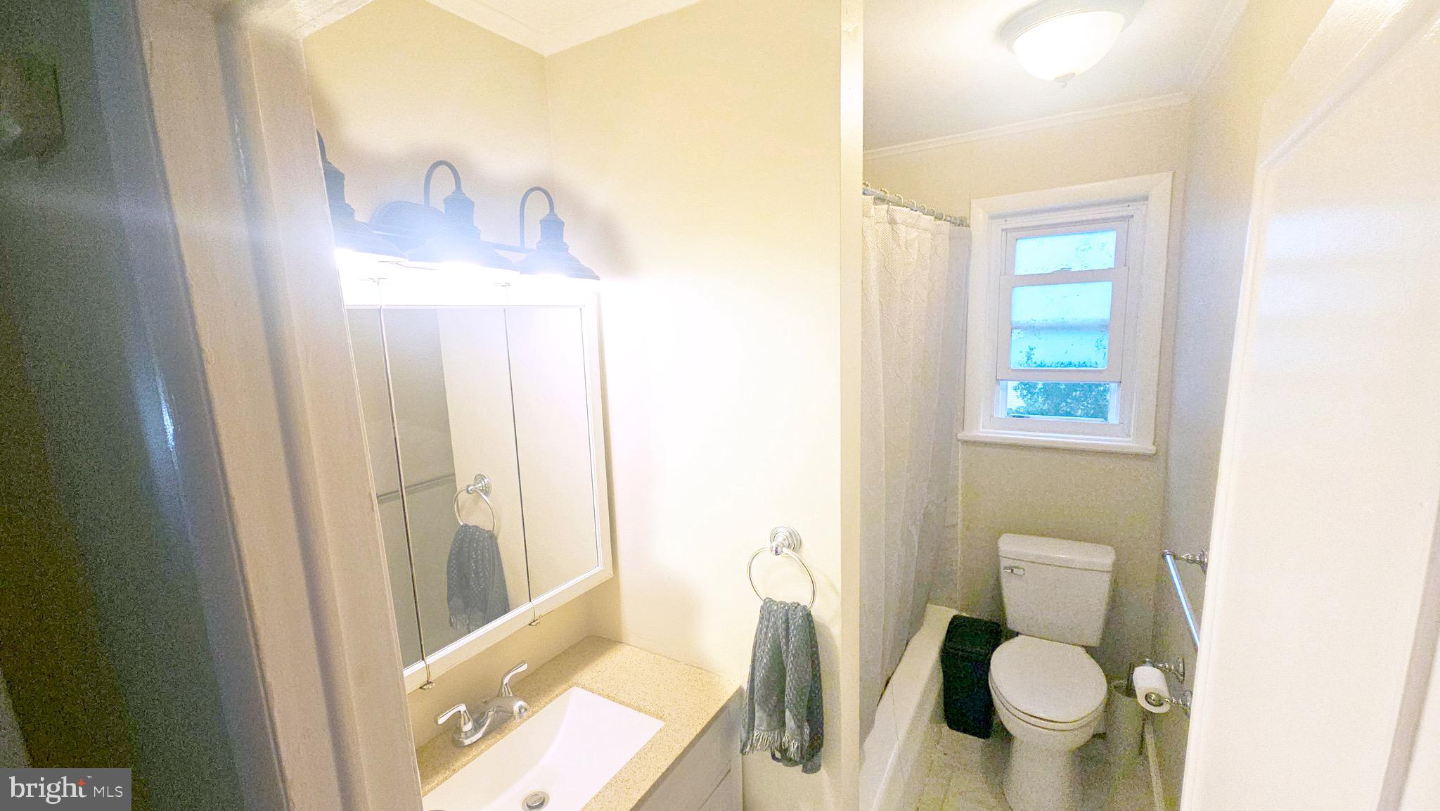 567 South Fairview Street Riverside, NJ 08075 - Photo 15 of 29 a bathroom with a toilet and a sink