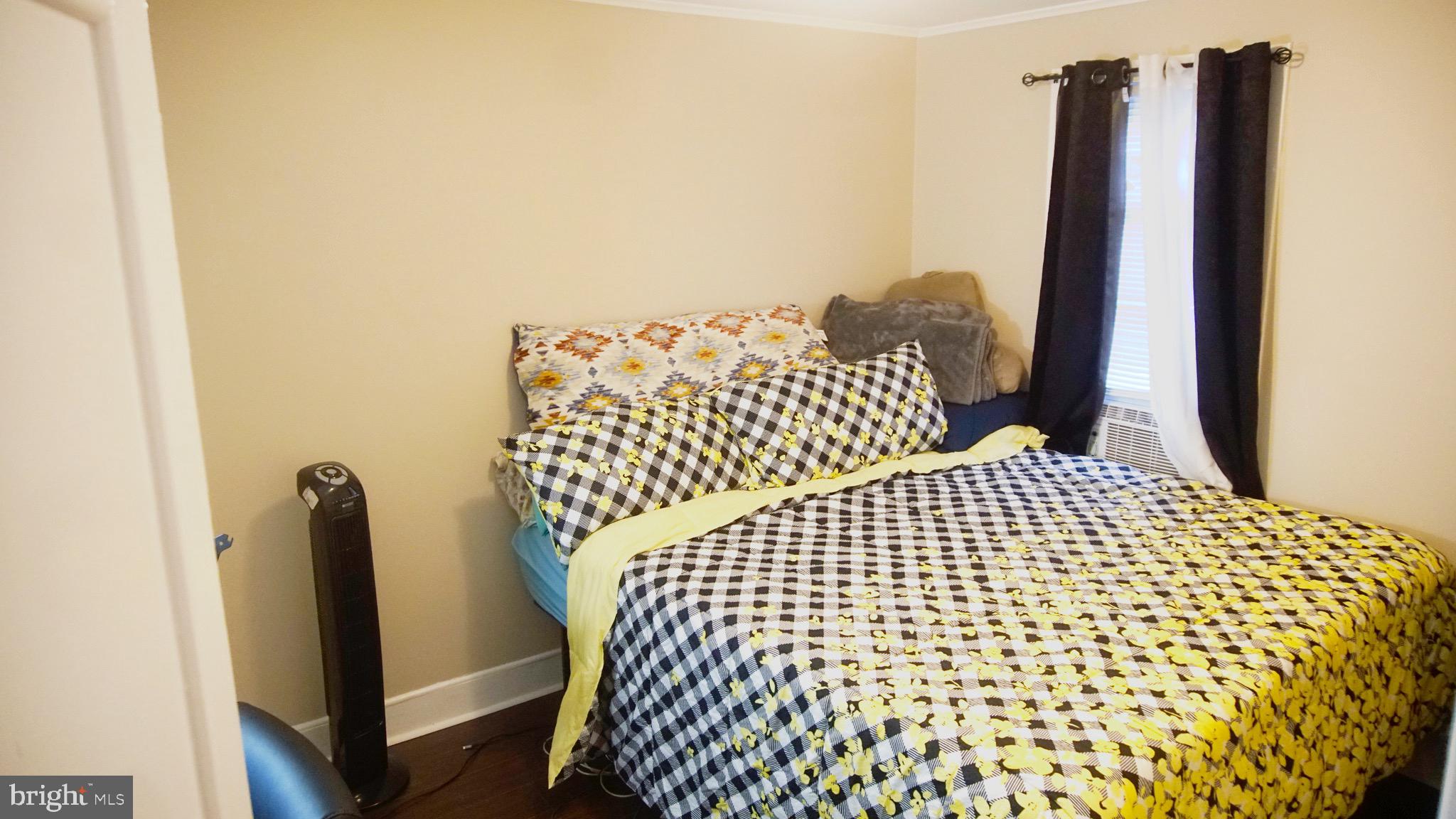 567 South Fairview Street Riverside, NJ 08075 - Photo 18 of 29 a bedroom with a bed and wooden floor