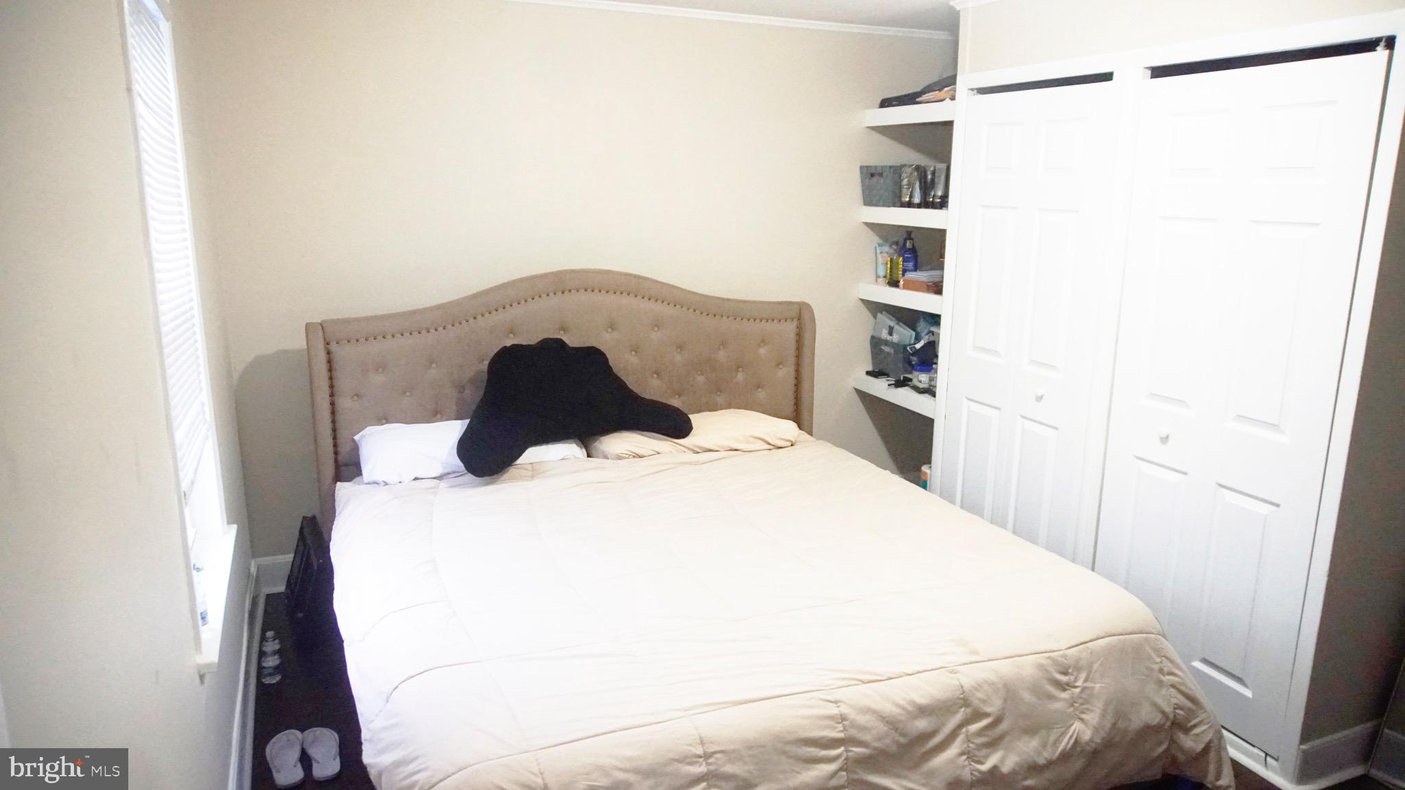 567 South Fairview Street Riverside, NJ 08075 - Photo 19 of 29 a bedroom with a bed and a cabinets