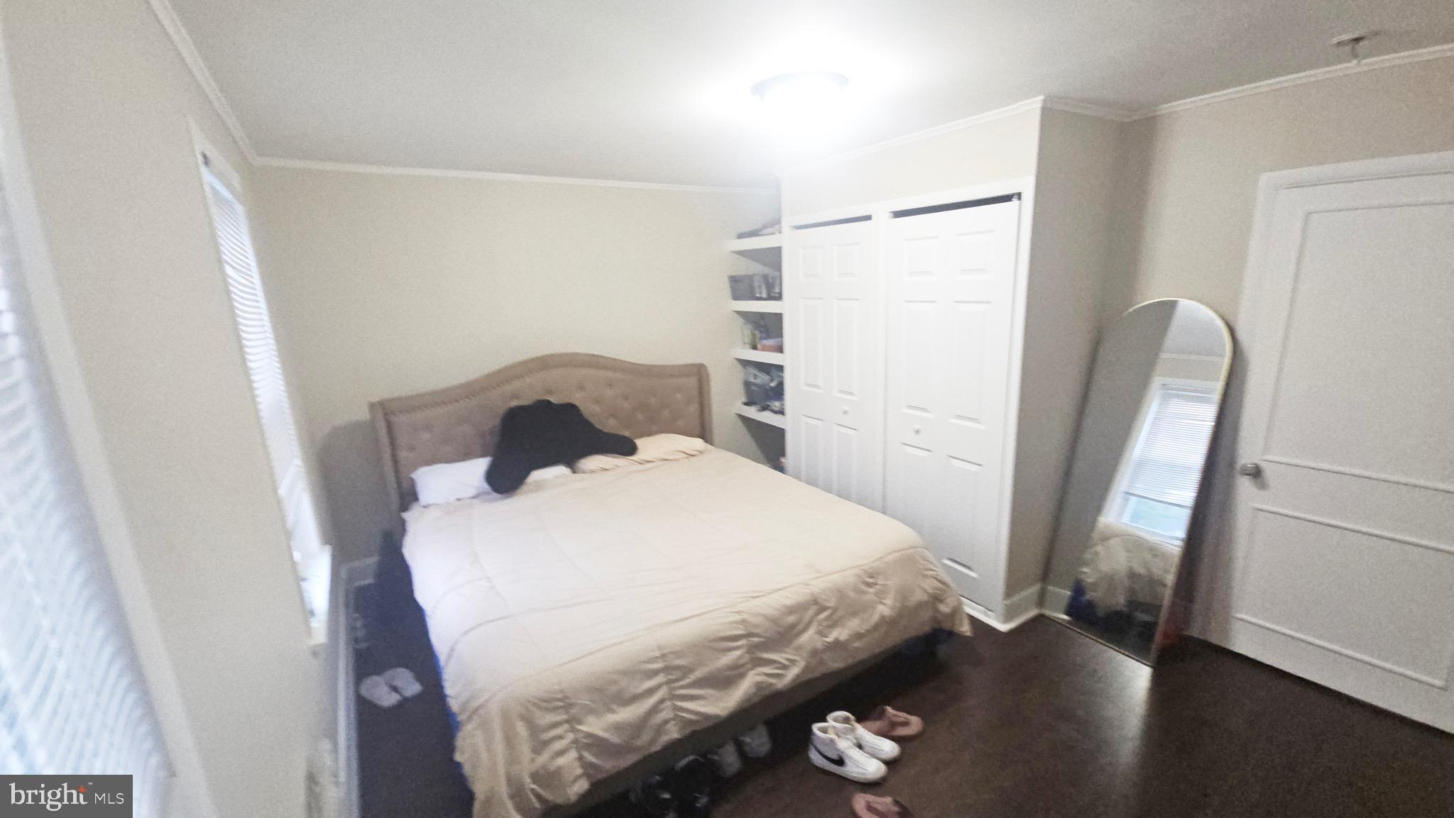 567 South Fairview Street Riverside, NJ 08075 - Photo 23 of 29 a bedroom with a bed and a mirror