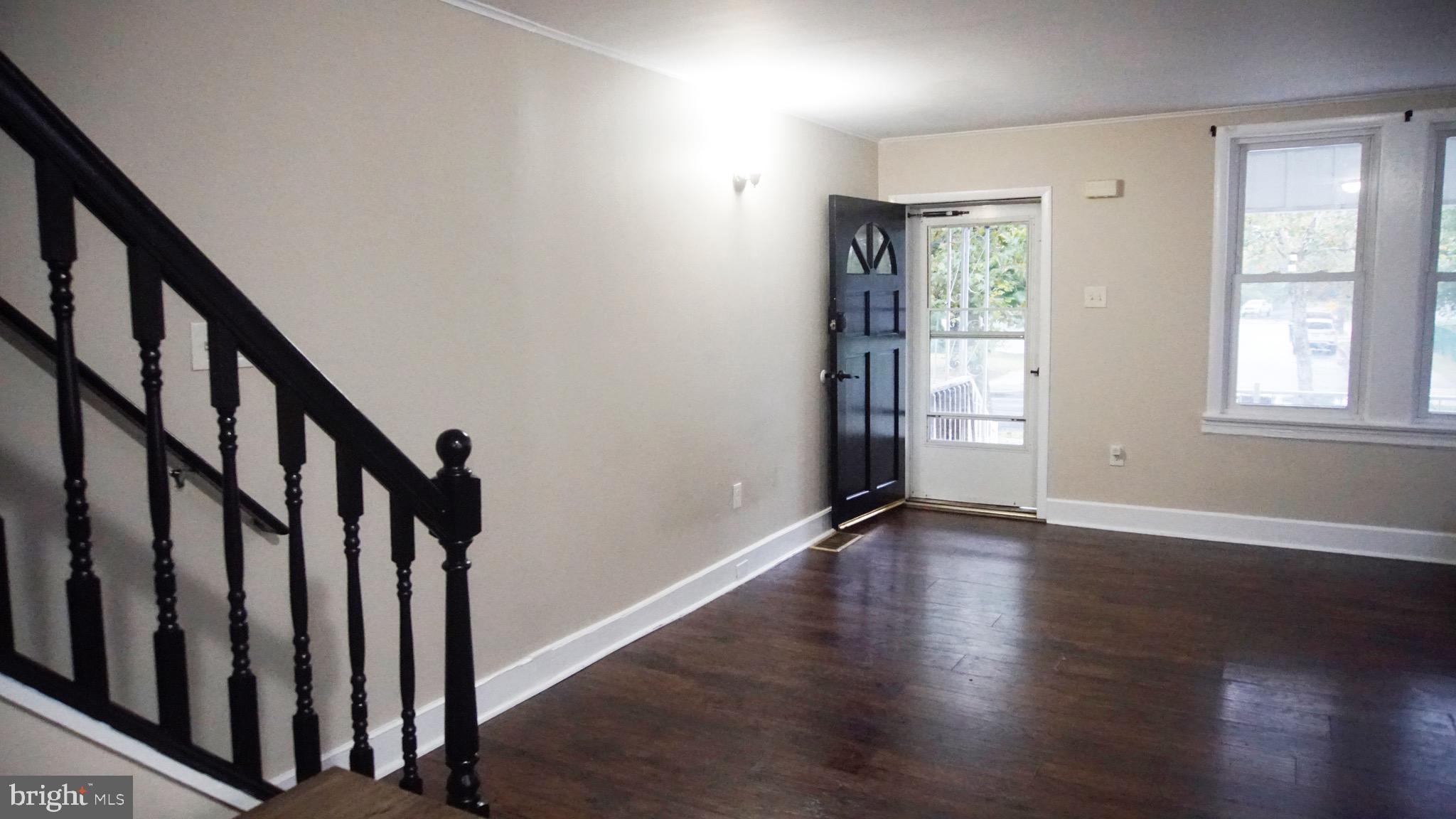 567 South Fairview Street Riverside, NJ 08075 - Photo 8 of 29 a view of an entryway with wooden floor and stairs