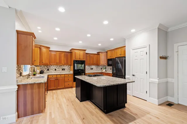 a kitchen with a stove and a sink